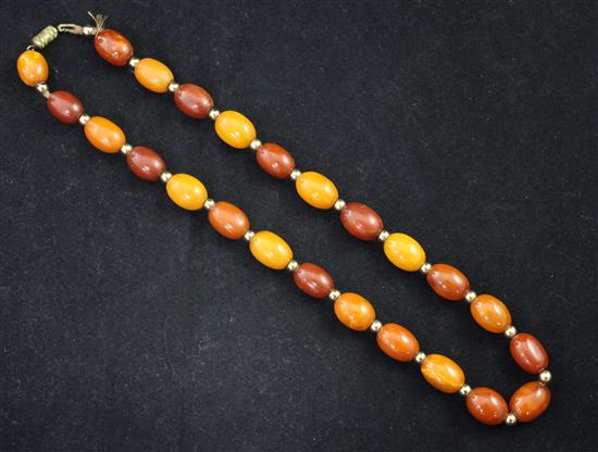 A single strand amber oval bead necklace, 18in.